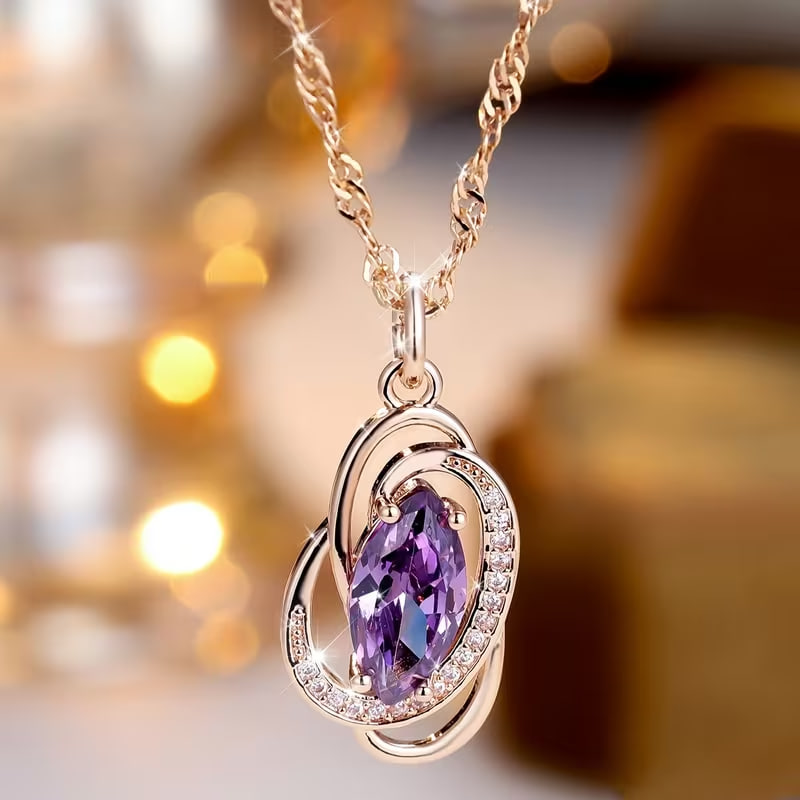 A Single Piece of Luxurious Jewelry Featuring a Golden Oval-Cut Purple Stone Pendant, Perfect for Weddings And As Stackable Gifts
